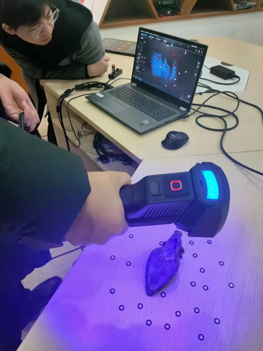 The co-creator team collects physical samples with hand-held scanners